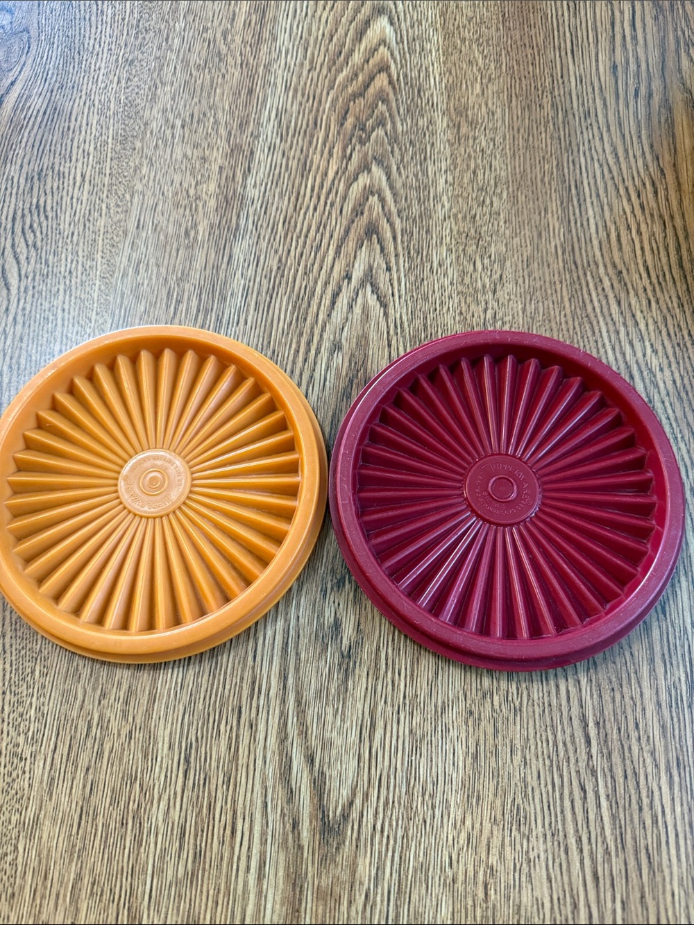 Tupperware replacement lids in orange and burgundy